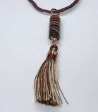 Elevate your style with the Brown Striped Column Agate Necklace, a beautifully designed piece that combines the natural elegance of striped agate with the luxurious feel of silk. This necklace features a stunning column of brown striped agate, complemented by a matching tassel, and is suspended on an adjustable silk cord, offering both versatility and sophistication.