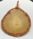 Wire wrapped Agate Slice Sun Catcher in Copper with iridescent Seed Bead Accents.