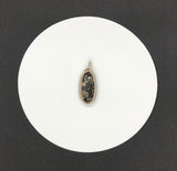 Intriguing Turritella Agate Pendant wrapped in Bronze and Sterling Silver.