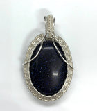 Glittering Blue Goldstone Pendant wrapped in Sterling Silver