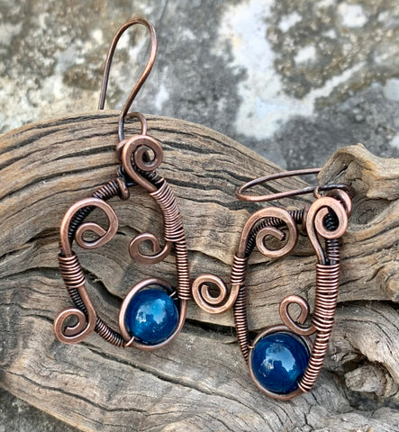 These freeform copper earrings feature hammered copper components, wire wrapped copper and apatite accent beads.
