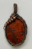 Colorful Poppy Jasper Pendant with brilliant red colors wrapped in copper with copper bead accents.