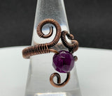 Brilliant Purple Faceted Fluorite Wire Wrapped Copper Ring that is adjustable.