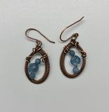 Hand woven Copper teardrop earrings with faceted Aquamarine and Fluorite Beads.