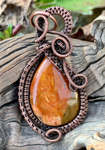 Graceful wire wrapped Copper Red Jasper Pendant.