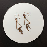 Hammered Copper Triangle Earrings with hammered Dangles and Copper Bead accents.