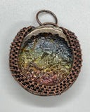 Beautiful colored Bismuth Pendant in wire wrapped copper.