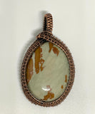 Lovely Blue and Brown Owyhee Jasper Pendant in wire wrapped Copper.
