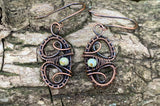 Delicate hand woven copper earrings with Czech glass beads and handmade copper ear wires.
