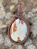 Lovely Blue and Brown Owyhee Jasper Pendant in wire wrapped Copper.