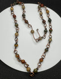 Handmade Copper Necklace with Picasso Jasper Beads. Contains 27 beads. 