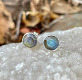 These Sterling Silver Stud Earrings feature stunning faceted Labradorite gemstones that shimmer with iridescent hues. The simple yet elegant design makes them versatile, perfect for daily wear or special occasions. Set in high-quality .925 Sterling Silver, these earrings offer a timeless and sophisticated look.