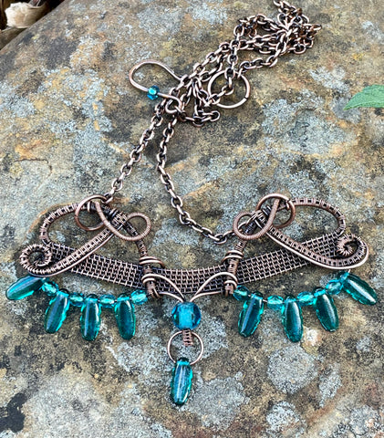 Statement Necklace in Wire Wrapped Copper with Teal Glass Beads and Dangles. 