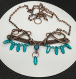 Statement Necklace in Wire Wrapped Copper with Teal Glass Beads and Dangles. 