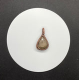 Self Collected Charlevoix Stone Pendant in Wire Wrapped Copper. 