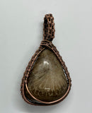 Self Collected Charlevoix Stone Pendant in Wire Wrapped Copper. 