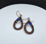 Hand woven Copper accented with sparkling Swarovski Crystals on hand made copper ear wires.