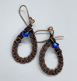 Hand woven Copper accented with sparkling Swarovski Crystals on hand made copper ear wires.