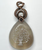 Agate Pendant with an etched tree of life in wire wrapped copper.  