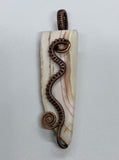 Polished Pink Banded Calcite Pendant in wire wrapped Copper.