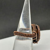 Wire wrapped Copper adjustable ring with a Smoky Quartz Cabochon Center.