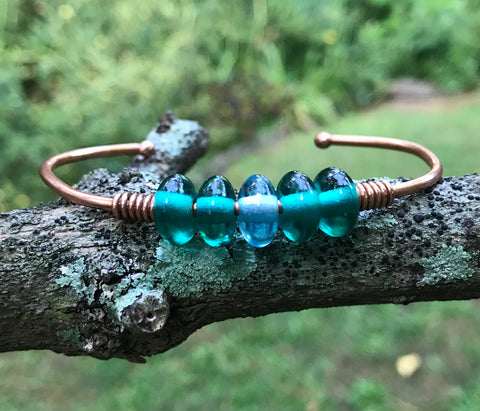 Add some Color and Bling with this Heavy Gauge Copper Bracelet - melted at the ends - with Glass Rondelle Beads. 