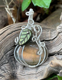 Flashy Orange Labradorite Pumpkin Pendant set in (.925) Sterling Silver with a Glass Leaf Accent.
