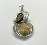 Flashy Orange Labradorite Pumpkin Pendant set in (.925) Sterling Silver with a Glass Leaf Accent.