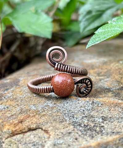 Wire Wrapped Copper and Goldstone Adjustable Ring. 