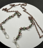 Copper Chain Eyeglass Holder Necklace with 5 Rainbow Kissed Spanish Moss Crystals on each side. Comes with adjustable rubber ends connectors. 