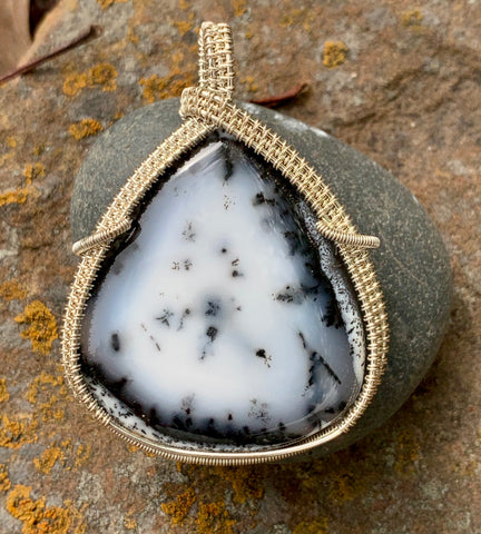 This stunning statement piece features a large Dendritic Opal Pendant wrapped in Sterling Silver.