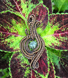Wire wrapped Copper Pendant with handwoven and coiled copper layers with a Rain Forest Jasper Center.