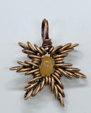 Shine like a star in this Bronze, Copper and Carnelian handcrafted star pendant! 