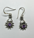 Faceted Amethyst Earrings set in a Sterling Silver Design.