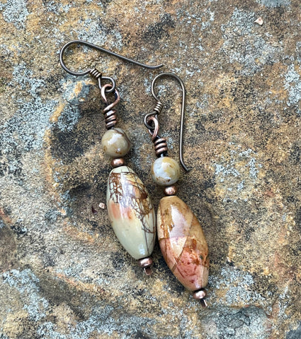 These beautiful earrings feature colorful Picasso Jasper stones, known for their unique, abstract patterns, paired with warm copper accents. The rich hues of the Jasper are perfectly complemented by the copper's natural warmth, creating a stunning, earthy combination. Finished with hypoallergenic niobium ear wires, these earrings are not only stylish but also comfortable for sensitive ears. A perfect accessory for those who love vibrant, nature-inspired jewelry with a touch of artistic flair.