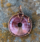 Colorful Pink to Purple Mookaite Jasper Donut Pendant wrapped in Copper. 