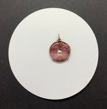 Colorful Pink to Purple Mookaite Jasper Donut Pendant wrapped in Copper. 