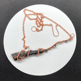 Wire Wrapped Copper and Raw Black Kyanite Broom Necklace with Hematite Star Accents.
