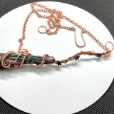 Wire Wrapped Copper and Raw Black Kyanite Broom Necklace with Hematite Star Accents.