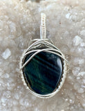 Beautiful Blue Chatoyant Tiger Eye Pendant in wire wrapped Sterling (.925) and Fine (.999) Silver.  