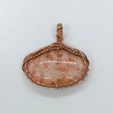 Sparkling Sunstone Pendant in Wire Wrapped Copper with glass bead accents. 
