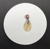 Lovely Translucent Striped Agate Pendant in Wire Wrapped Copper. 
