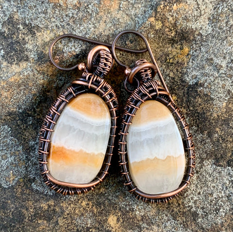 Banded Calcite earrings in wire wrapped copper with Niobium ear wires. 