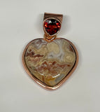 Colorful Laguna Lace Agate Heart Pendant in Copper with Garnet Gemstone in the Bail.