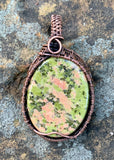 Multi-colored green and pink Unakite Pendant in Wire wrapped copper. Unakite is a true rock: a composite material made up of multiple other stones - this gives unakite its familiar moss-on-brick appearance.