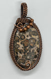 Beautiful spotted Leopard Skin Jasper Pendant wrapped in handwoven copper with copper bead accents.  