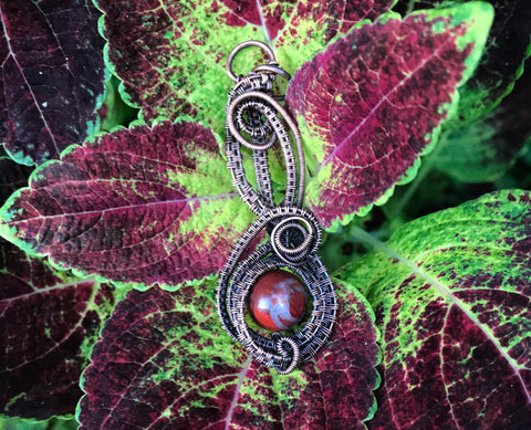Rainbow Jasper intricately woven copper pendant designed by Monkeylion Designs