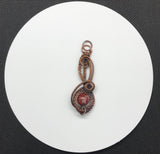 Rainbow Jasper intricately woven copper pendant designed by Monkeylion Designs