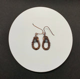 Graceful hand woven copper earrings with Labradorite accents.