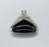 This Velvet Obsidian Pendant is a stunning piece of jewelry featuring an obsidian stone that appears black in some lights but reveals burgundy and purple ripples under certain angles of light. This unique visual effect, combined with its sleek Sterling Silver (.925) setting, makes the pendant both elegant and captivating. The pendant is perfect for those who appreciate jewelry that exudes mystery and sophistication.